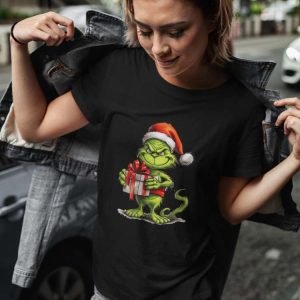 Green Guy Holding A Present With Red Ribbon